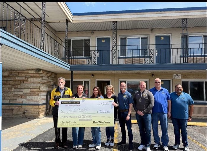 Marquette Bank employees present an $80,000 donation to BEDS Plus at the Cicero AVenue Transitional Shelter groundbreaking.