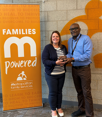 Jennifer Corbett, First Vice President & BSA/AML/OFAC Officer, accepts Outstanding Partner Award from Metropolitan Family Services Midway Center’s Louis Hill