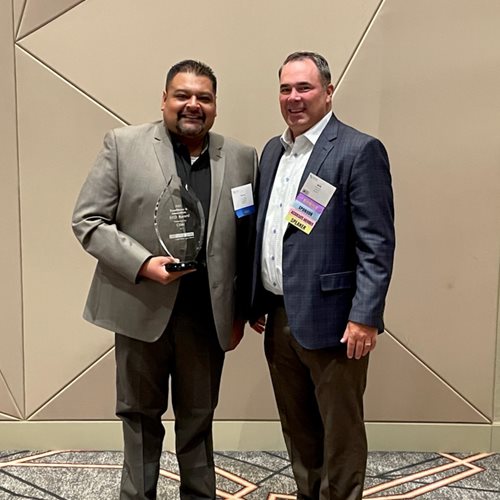 2021 Excellence & Innovation BKD Award - Presented to Manny Jimenez, First Vice President of CRA by CBAI to Marquette Bank