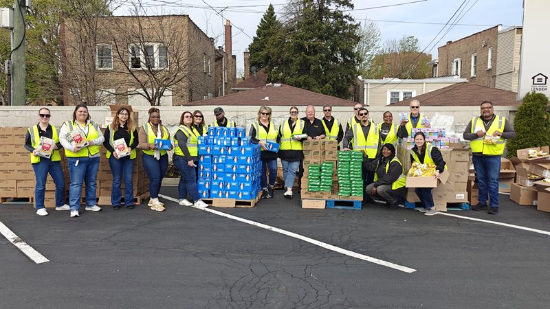 o	Marquette Bank employees prepare for Mobile Food Pantry event at the original bank location at 63rd & Western Ave